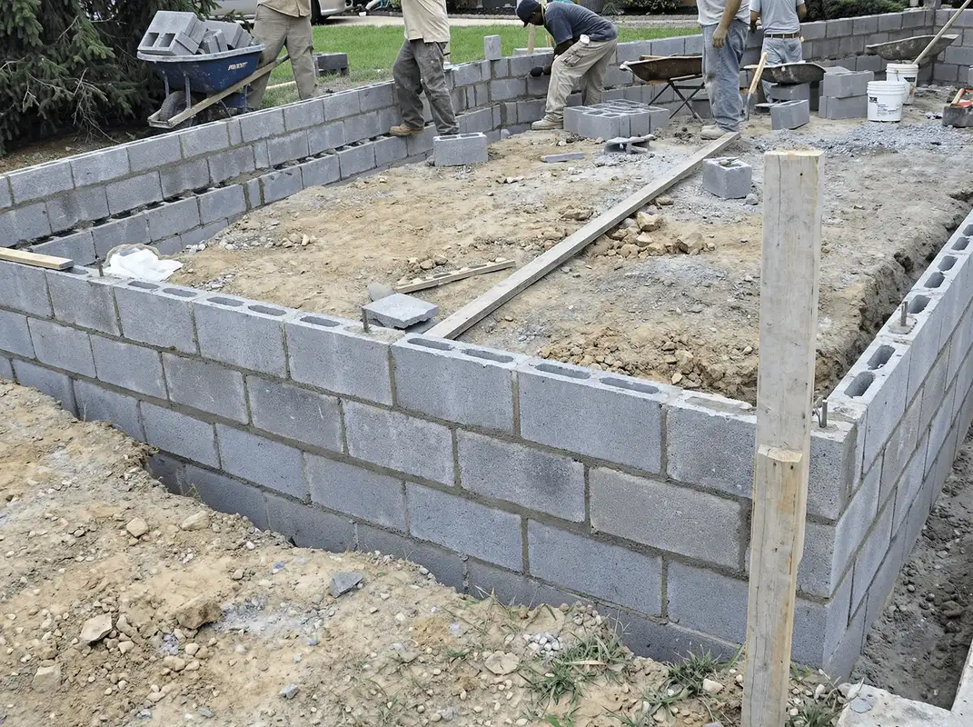 Professionals building a foundation with blocks in Savannah, GA